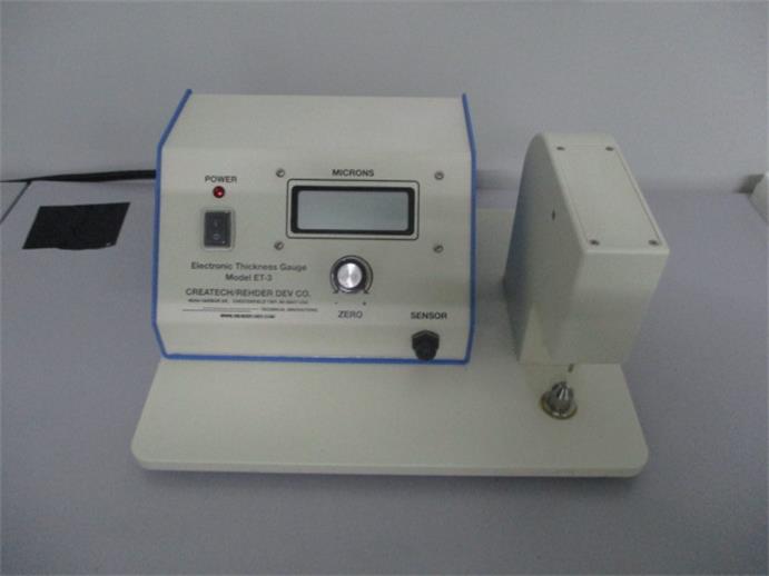 Electronic thickness gauge — precision measurement of contact lens center and edge thickness