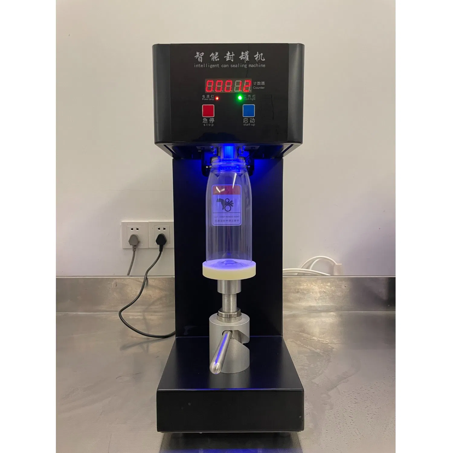 Black Semi-Automatic Tin Can Sealing Seaming Mach Intelligent Small Portable Plastic Beer Canning Juice Coffee Cup Lid Sealing Machine (QLS-180B-180W-220V.50Hz)