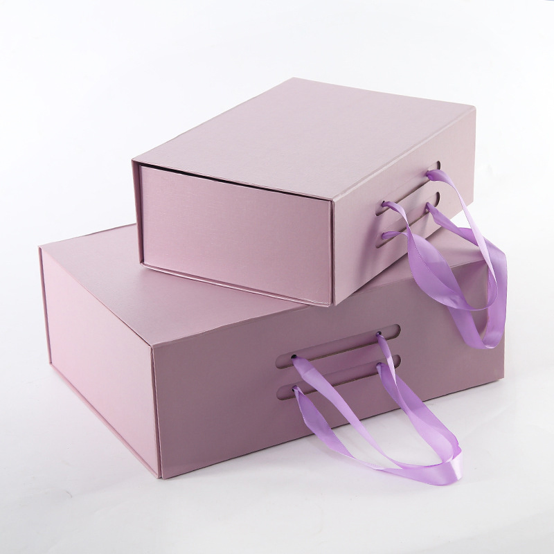 Caja de regalo de cartón rígido plegable de lujo con impresión colorida personalizada, magnética, rosa, con asa de cinta