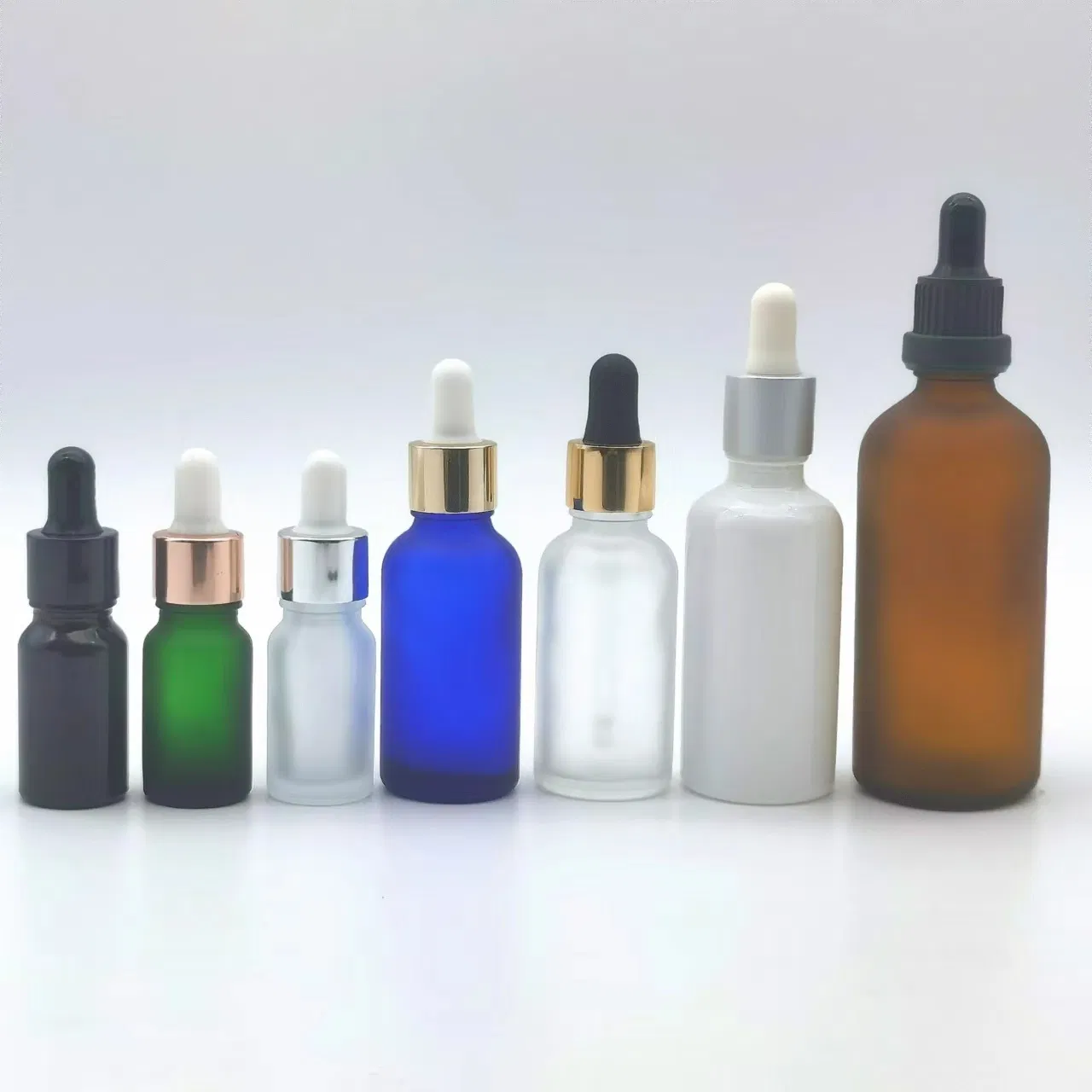 Hot Selling Spot Luxury Empty Serum Oil White Transparent Green Blue Glossy Glass Dropper Bottle with Pipette Gold Screw Lid 1oz 10ml 30ml 50ml 100ml