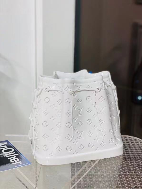 Wholesale new ceramic vase ornament Made to the exact dimensions of the Noé BB handbag, this porcelain vase is a testament to the brand's craftsmanship. Manufacturers, Suppliers