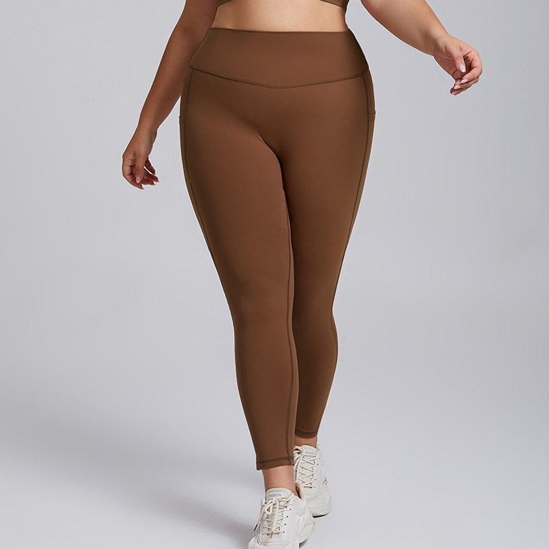Pantalones de yoga ajustados sin costuras de talla grande con bolsillo para mujeres en el gimnasio