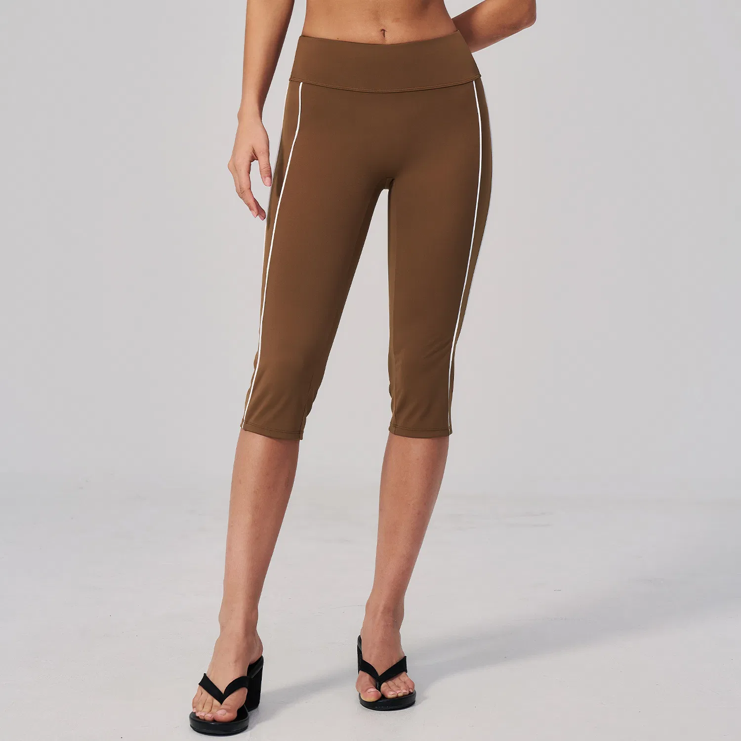 Leggings de capri de cintura alta al por mayor con detalle de franja lateral