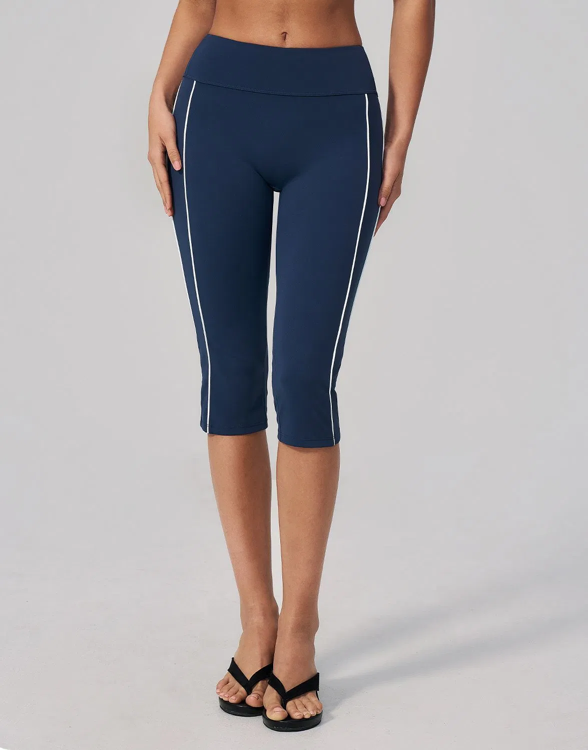 Leggings de capri de cintura alta al por mayor con detalle de franja lateral