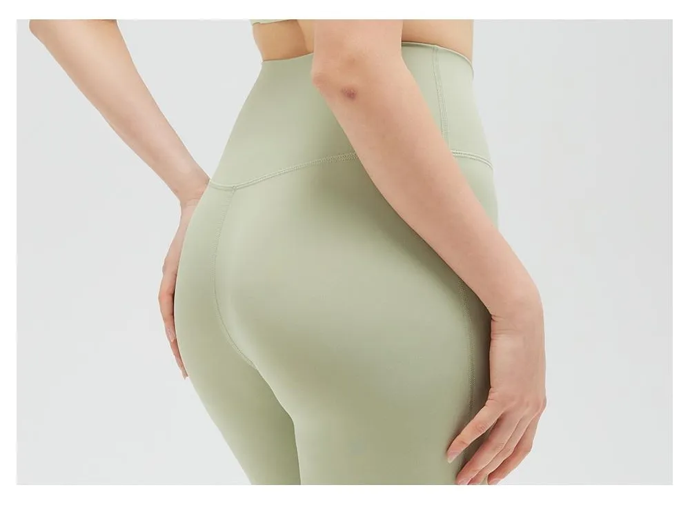 Mallas de yoga de nylon y spandex de sensación nude al por mayor, personalización de color y logo, pantalones de fitness transpirables y anti-fricción