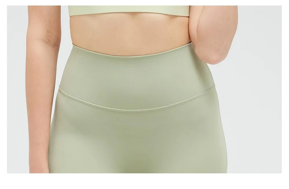 Mallas de yoga de nylon y spandex de sensación nude al por mayor, personalización de color y logo, pantalones de fitness transpirables y anti-fricción