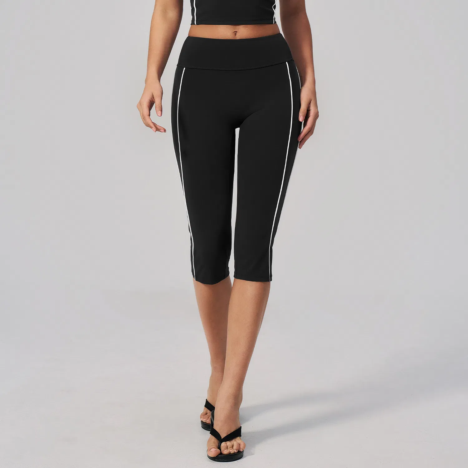 Leggings de capri de cintura alta al por mayor con detalle de franja lateral