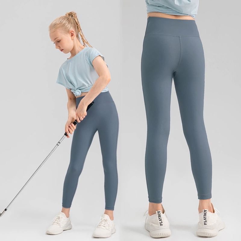 Pantalones de compresión suaves premium al por mayor sin línea T para niñas jóvenes, leggings atléticos de cintura alta para niños, mallas de yoga para jóvenes
