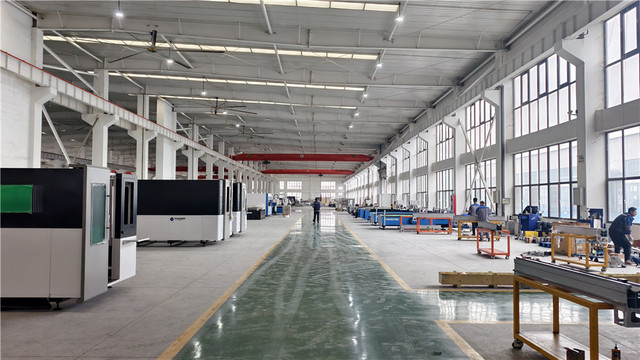 Datum Machine fiber laser cutting system in operation — high-speed sheet metal processing