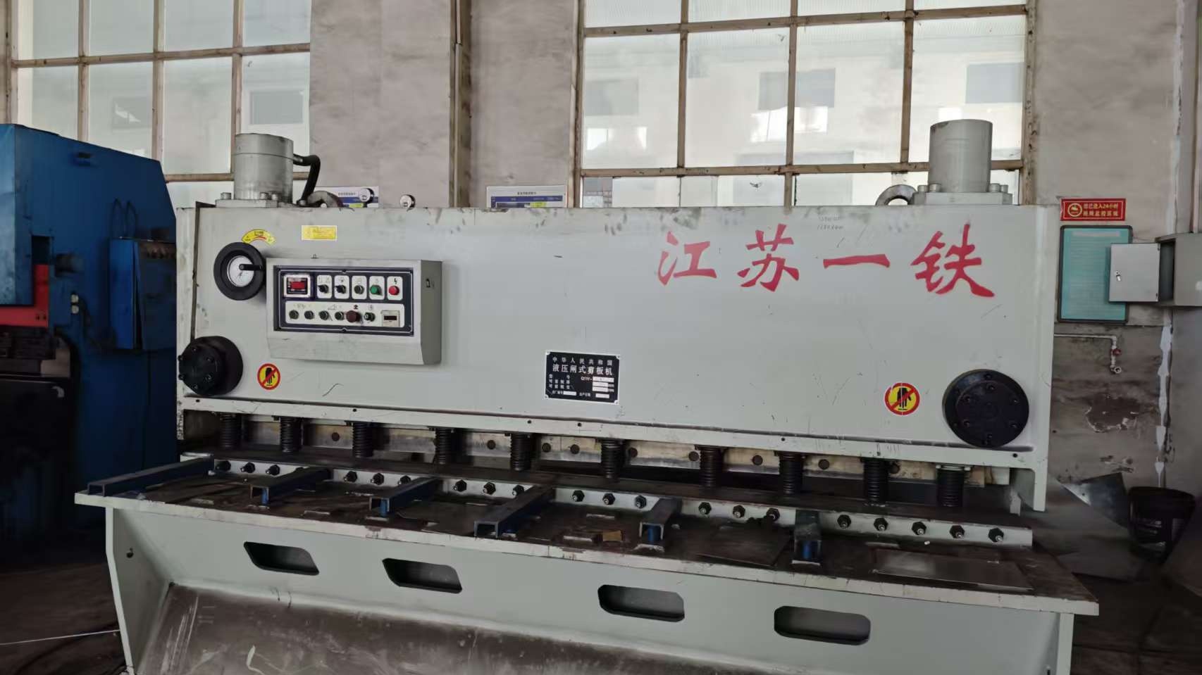 Shearing machine for elevator sheet metal processing at Dave Lift factory