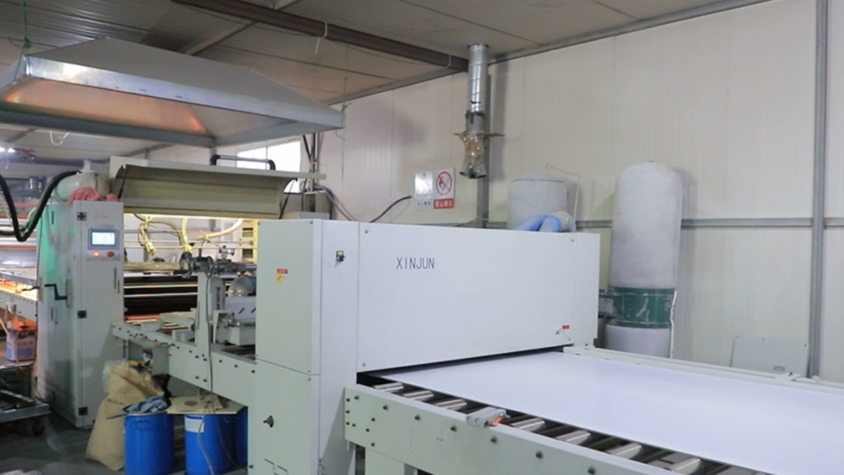 Surface laminating process for PVC wall panels creating high-quality finishes