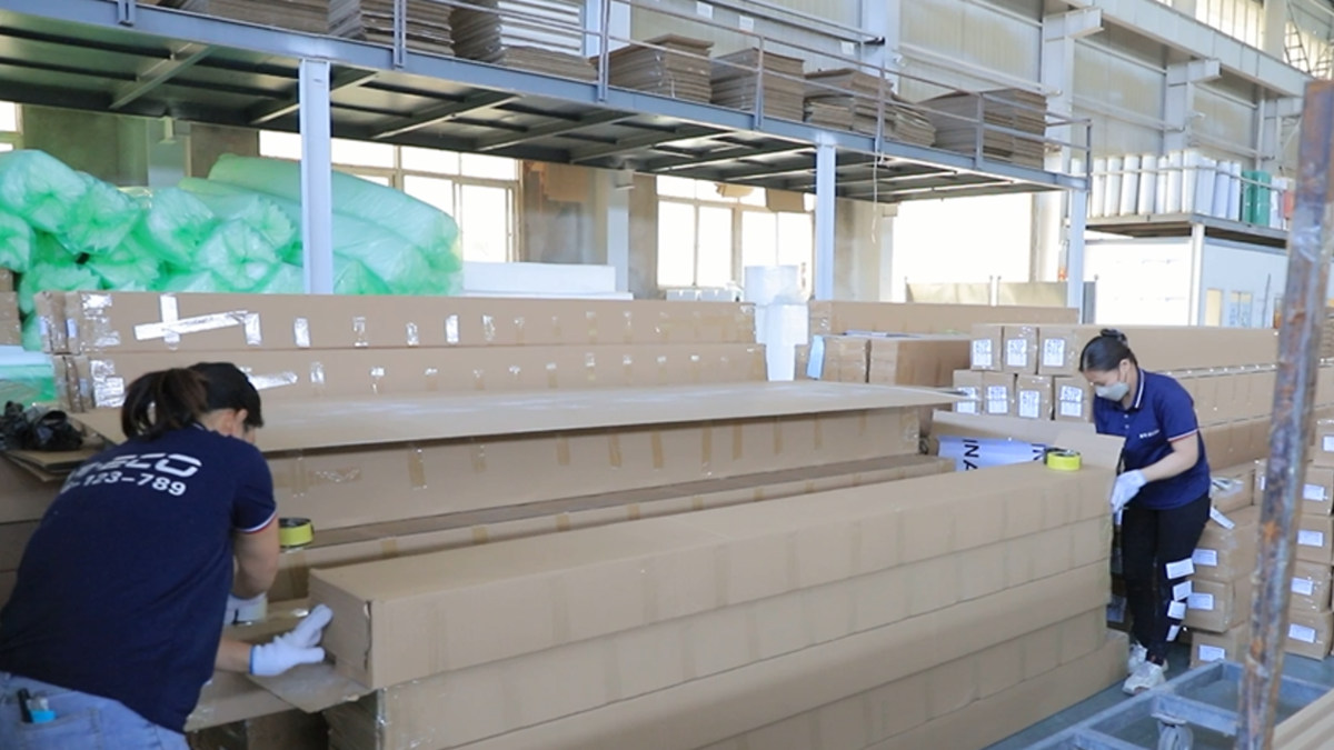 Final packing and quality check of finished PVC panels before export shipment