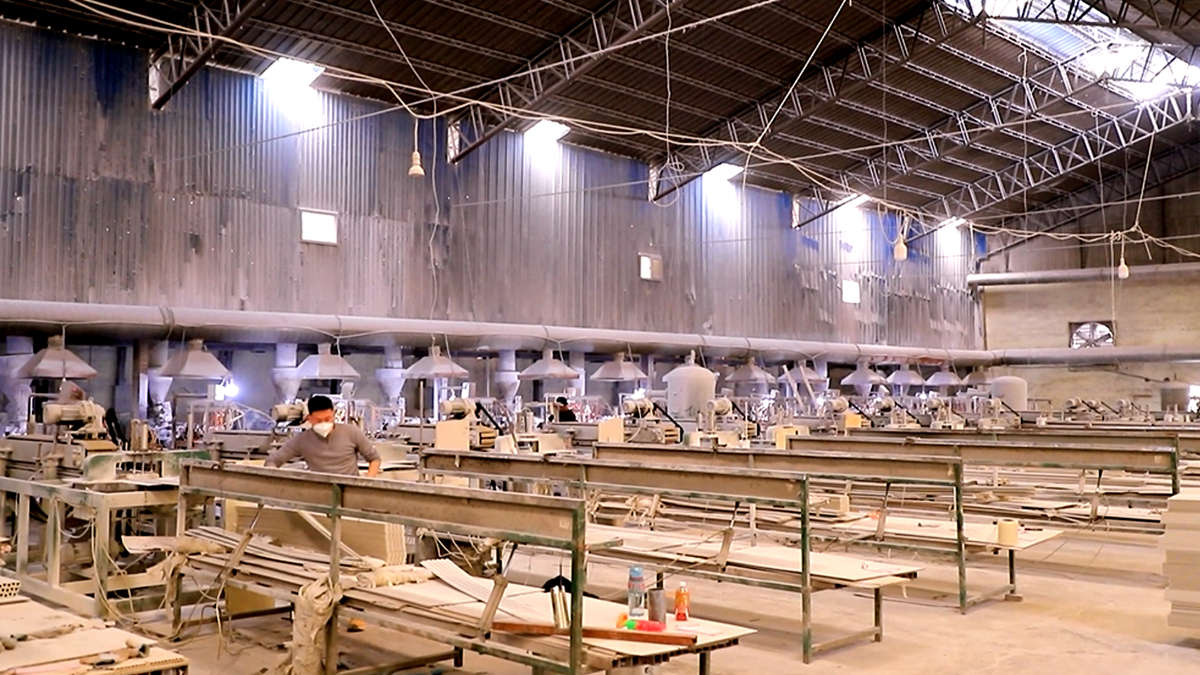 PVC panel extrusion production process showing manufacturing equipment