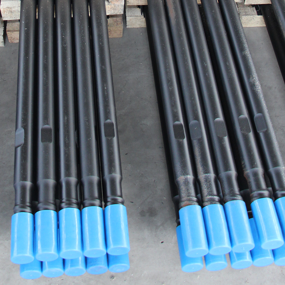 Top hammer drill tool