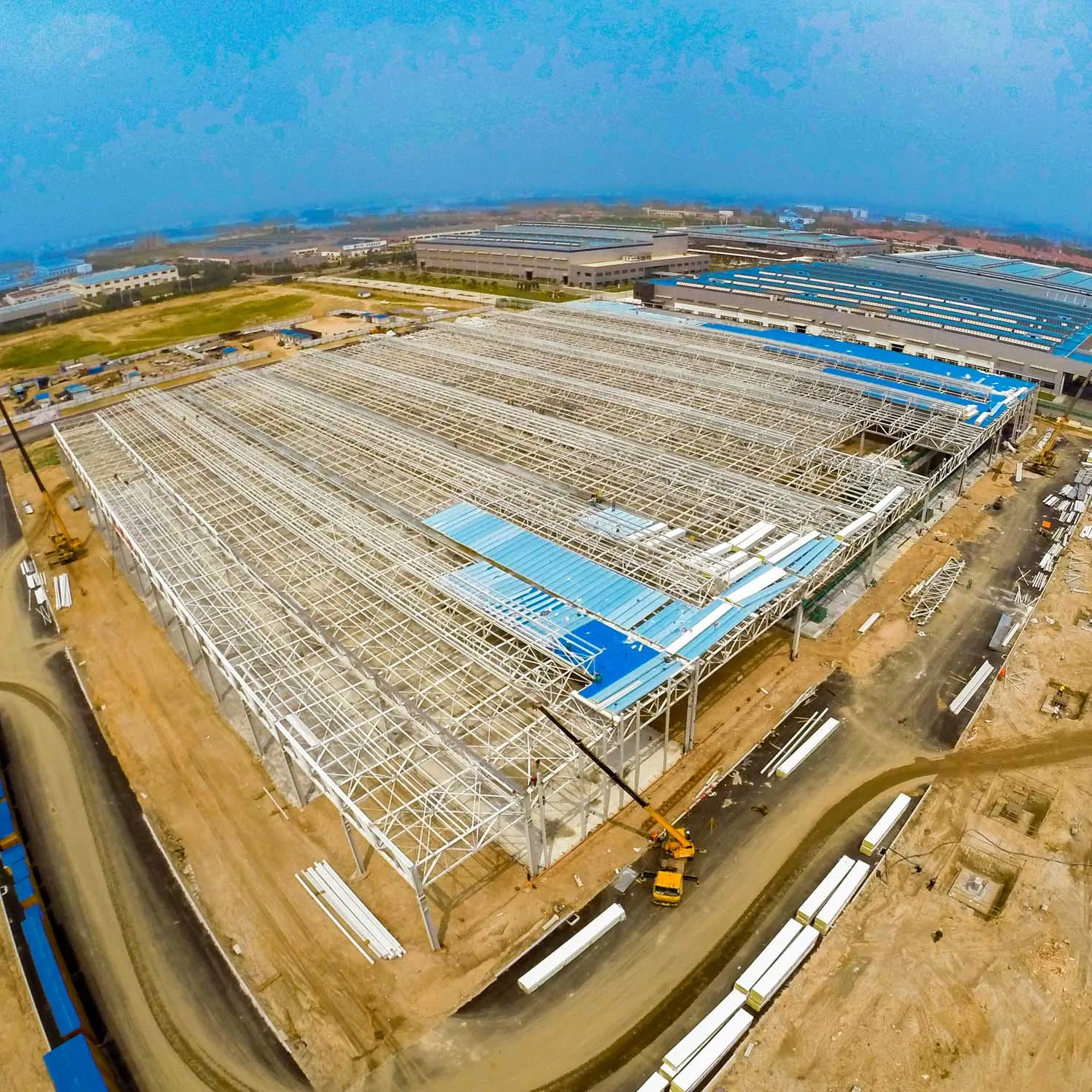 Large Span Prefabricated Steel Structure Frame Pre-Engineered Metal Commercial Building Workshop Warehouse