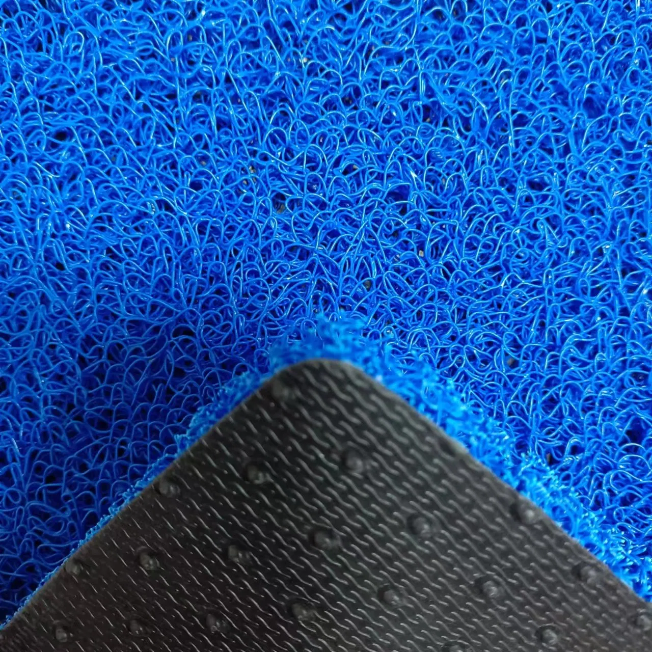 Alfombra de bobina de PVC antideslizante con respaldo de picos para decoración de automóviles