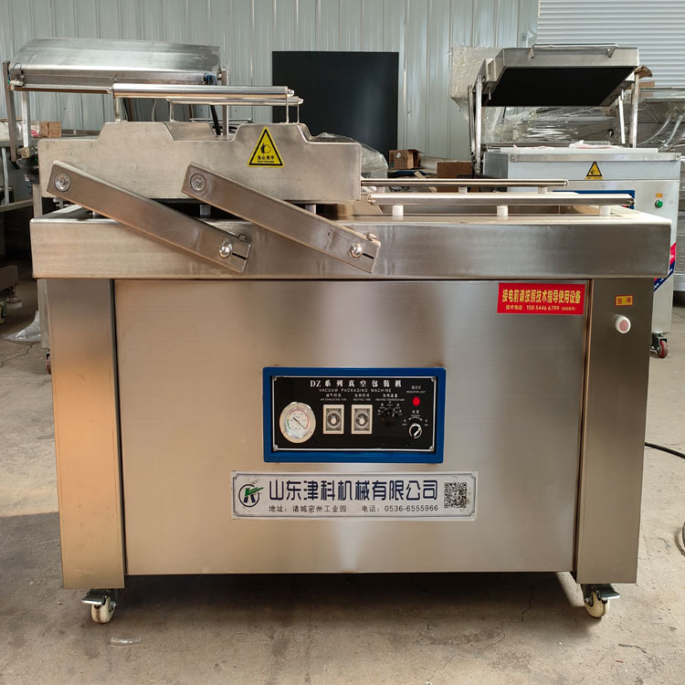 Double chamber recessed vacuum packing machine