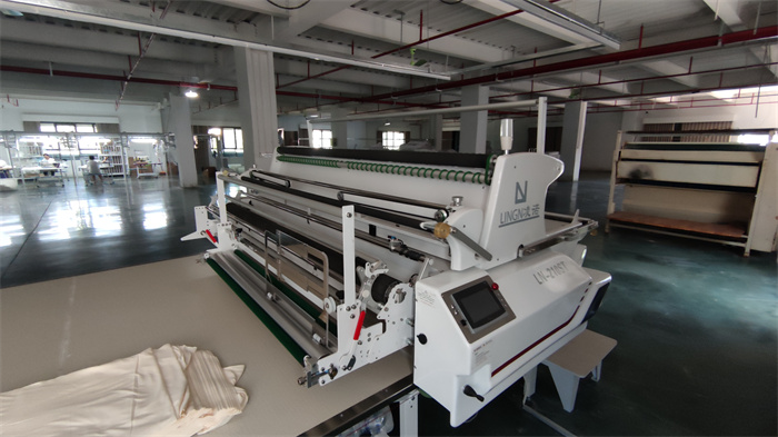 Automated cloth laying machine for efficient fabric spreading at Eglin Fashion