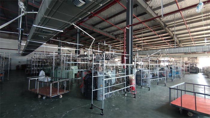 Fabric weaving process at Eglin Fashion textile manufacturing