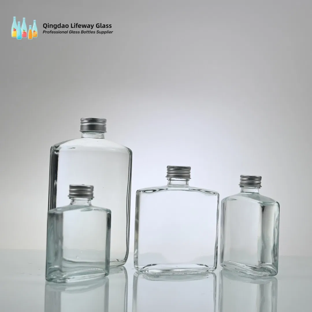 250ml 330ml 500ml 750ml Clear Frosted Glass Spring Water Bottles with Lid for Soda Sparking Water Beverage Juice Packaging with Customzied Logo with Label