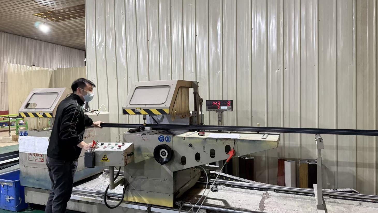 CNC precision cutting of aluminum profiles in Envi production workshop