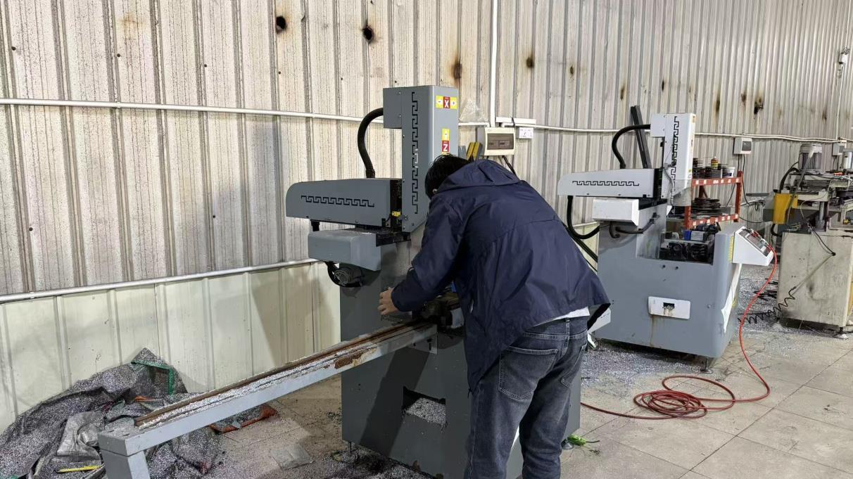 Drilling operation on aluminum door and window profiles at Envi manufacturing plant