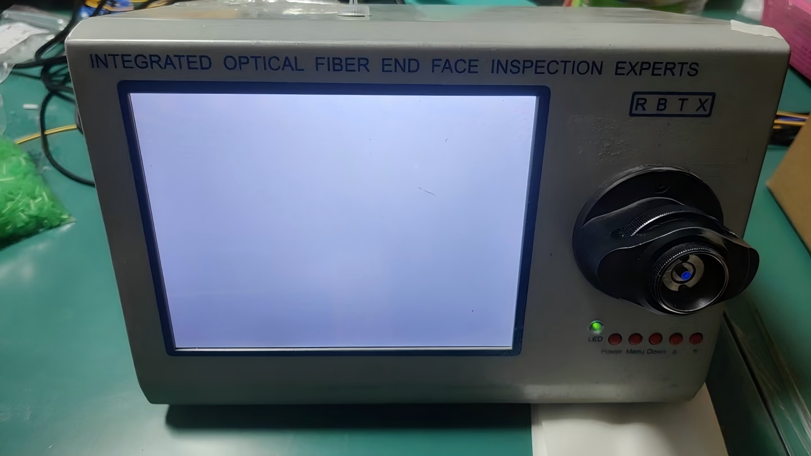 Integrated optical fiber end face inspection system for connector quality verification