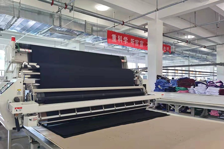 E-SONG Apparel main production facility in Linyi City, Shandong — medical and chef uniform manufacturing floor