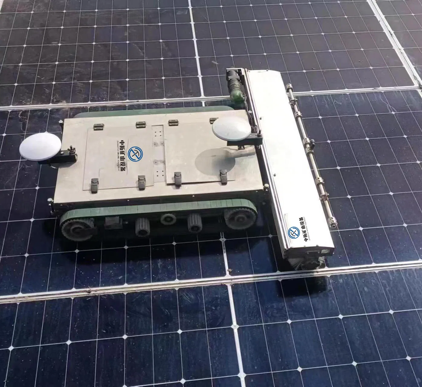 Night-Operable and Waterproof Solar Panel Cleaning Robot for Harsh Environments