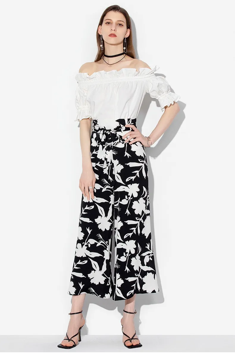 Model wearing wide-leg trousers view 2