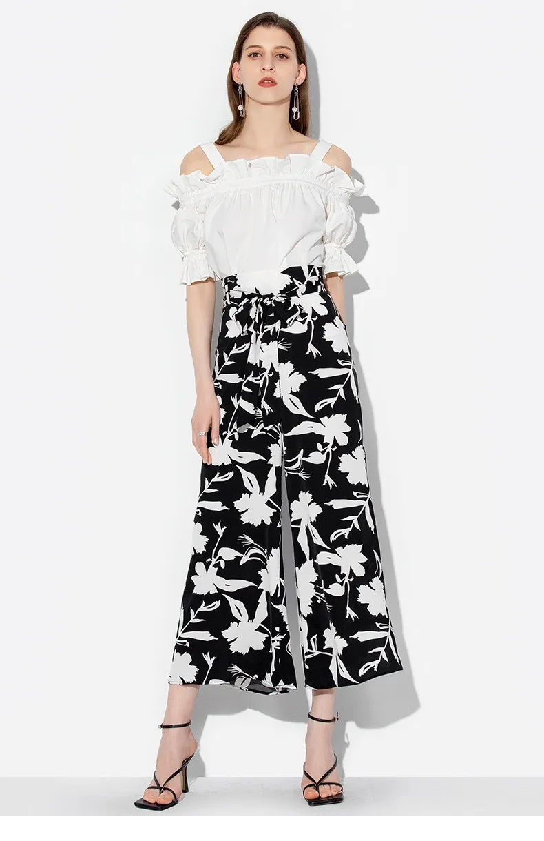 Model wearing wide-leg trousers view 1