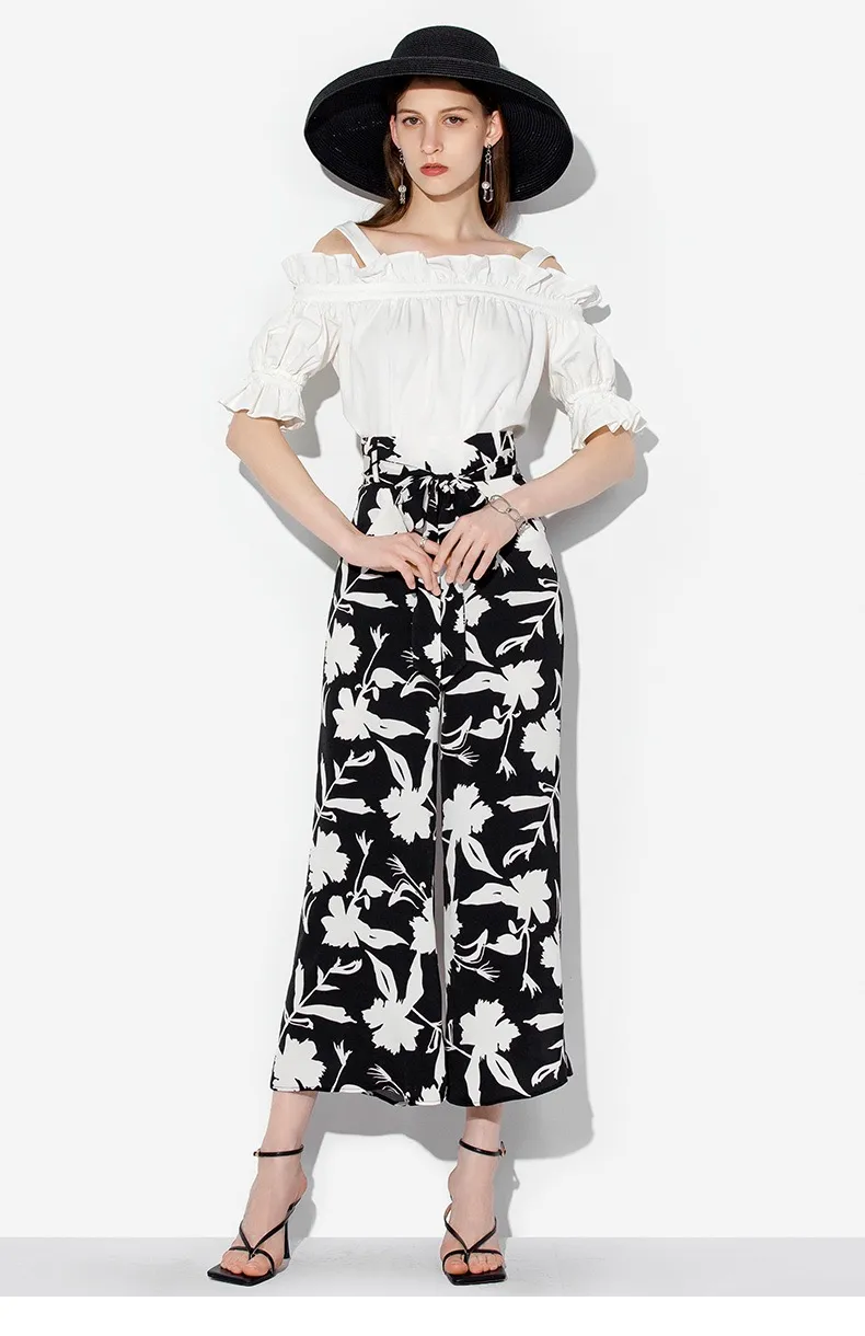 Model wearing wide-leg trousers view 5