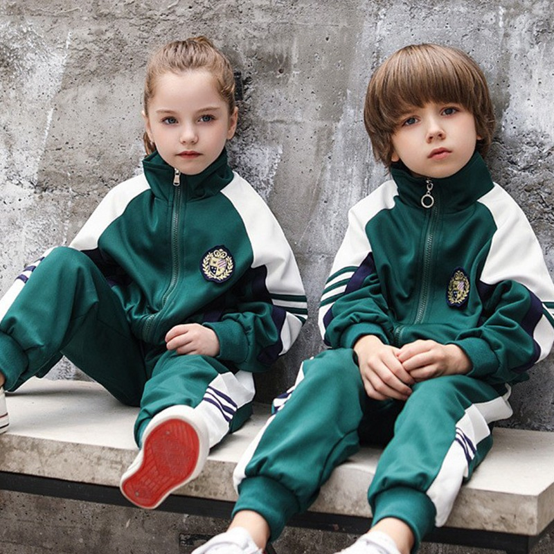 Conjunto escolar de deporte para niños en bloque de color verde oscuro, pantalones de chándal con cuello alto, atuendo de primavera y otoño para el campus