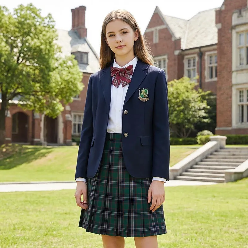 Uniforme escolar británico clásico para niñas, blazer azul marino de doble botonadura, falda plisada de cuadros verdes y corbata de lazo de cuadros rojos