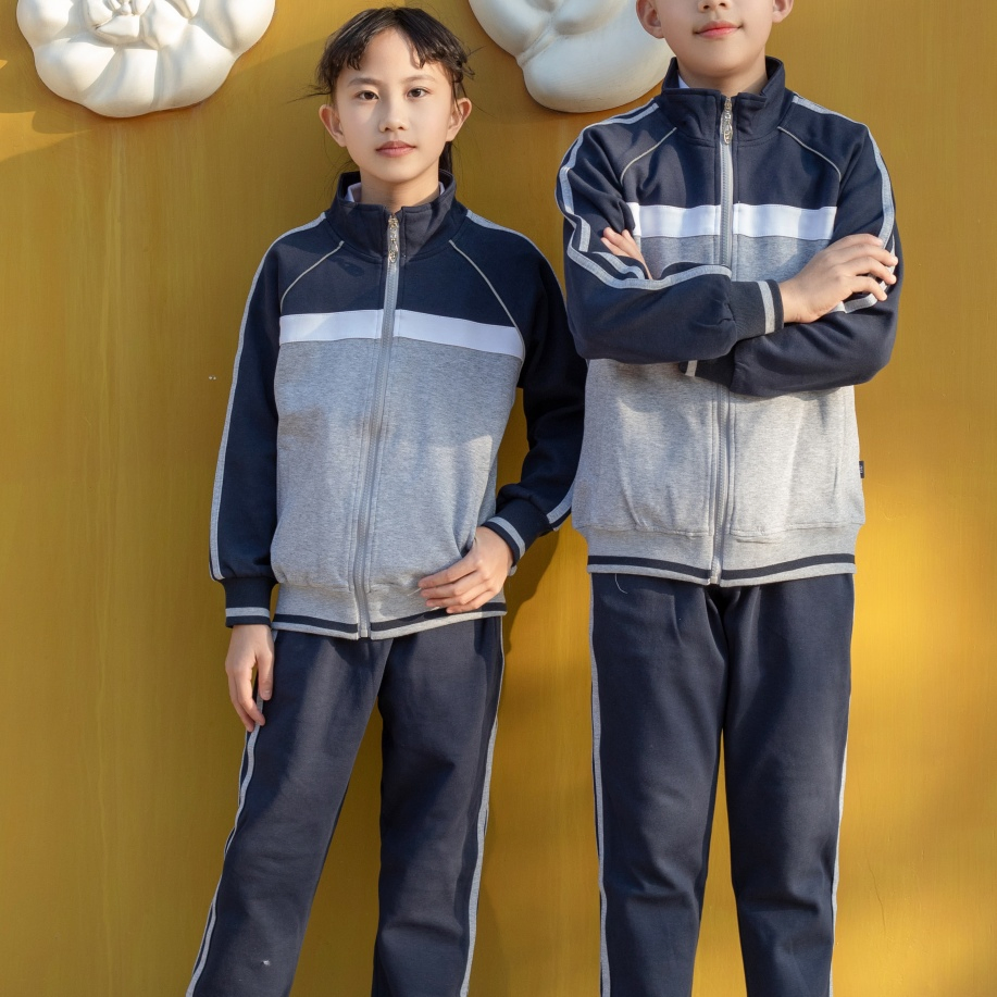 Traje de pista escolar hipoalergénico de marca propia que absorbe la humedad para niños en educación