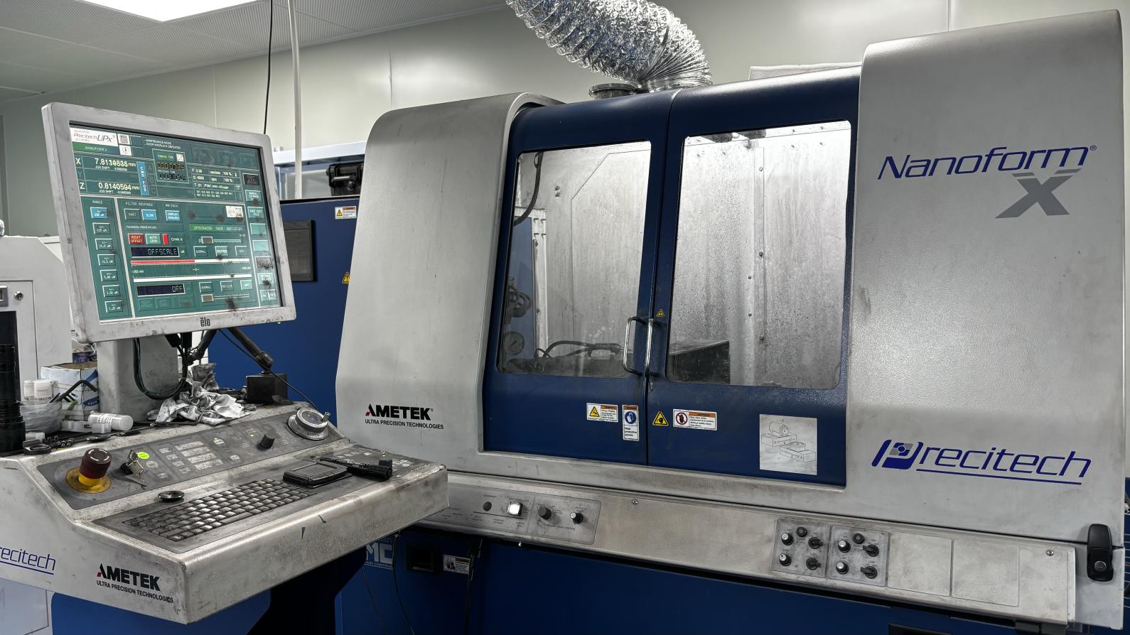 Single-point diamond turning machine for precision optical surface machining