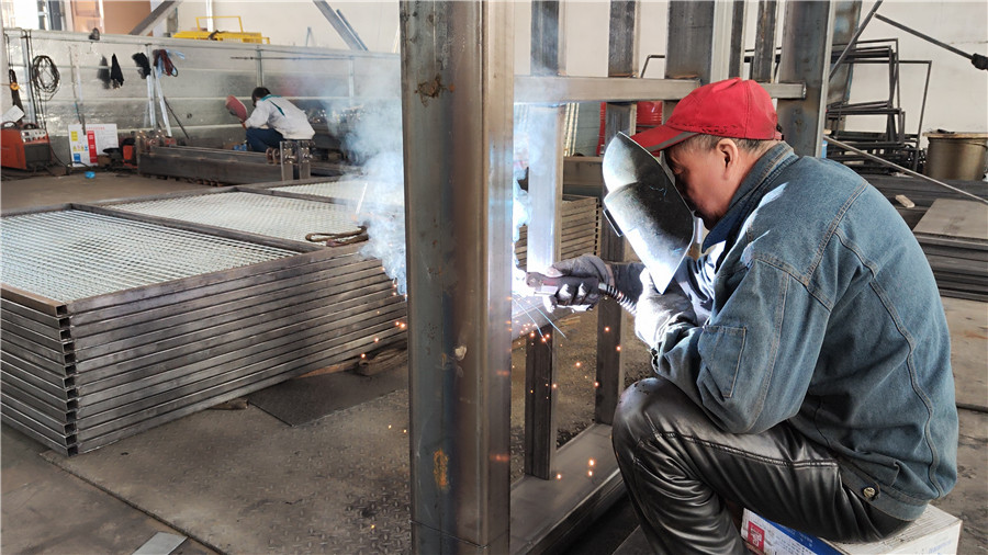 Welding process joining elevator structural steel frame and components