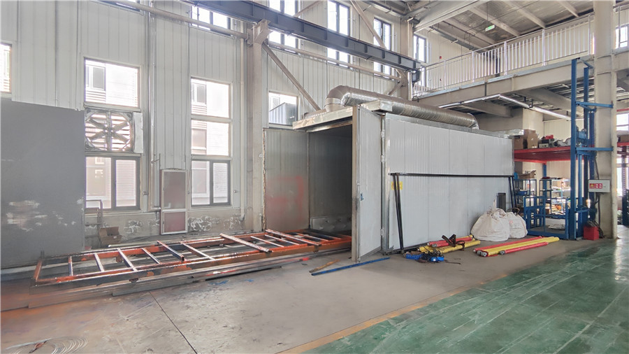 Spray painting process applying protective and decorative coating to elevator cabin