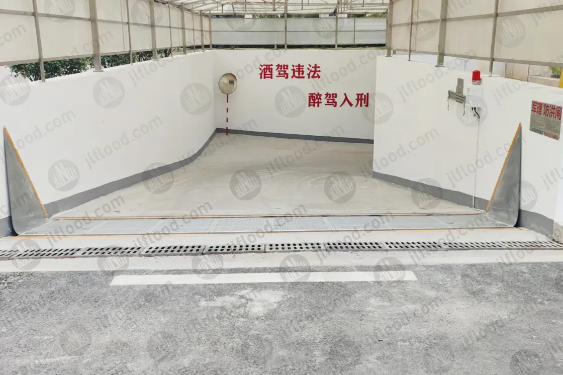 Garage flood barrier at an underground parking ramp