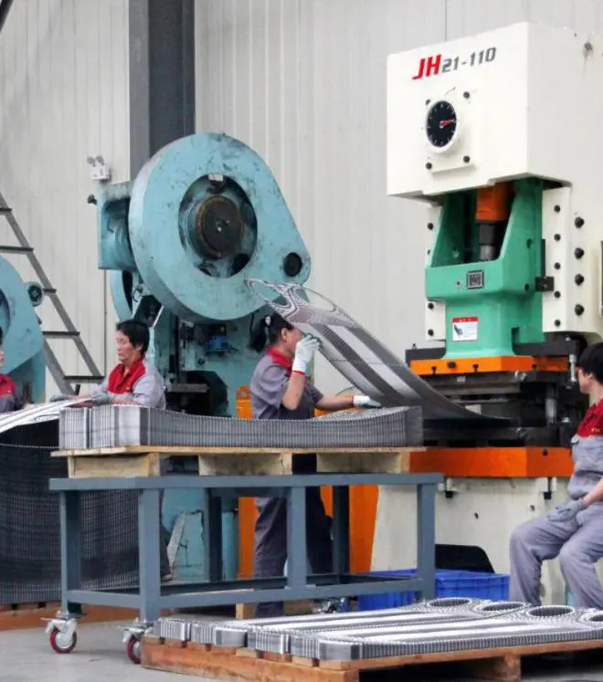 Plate punching process for corrugated heat exchanger plates