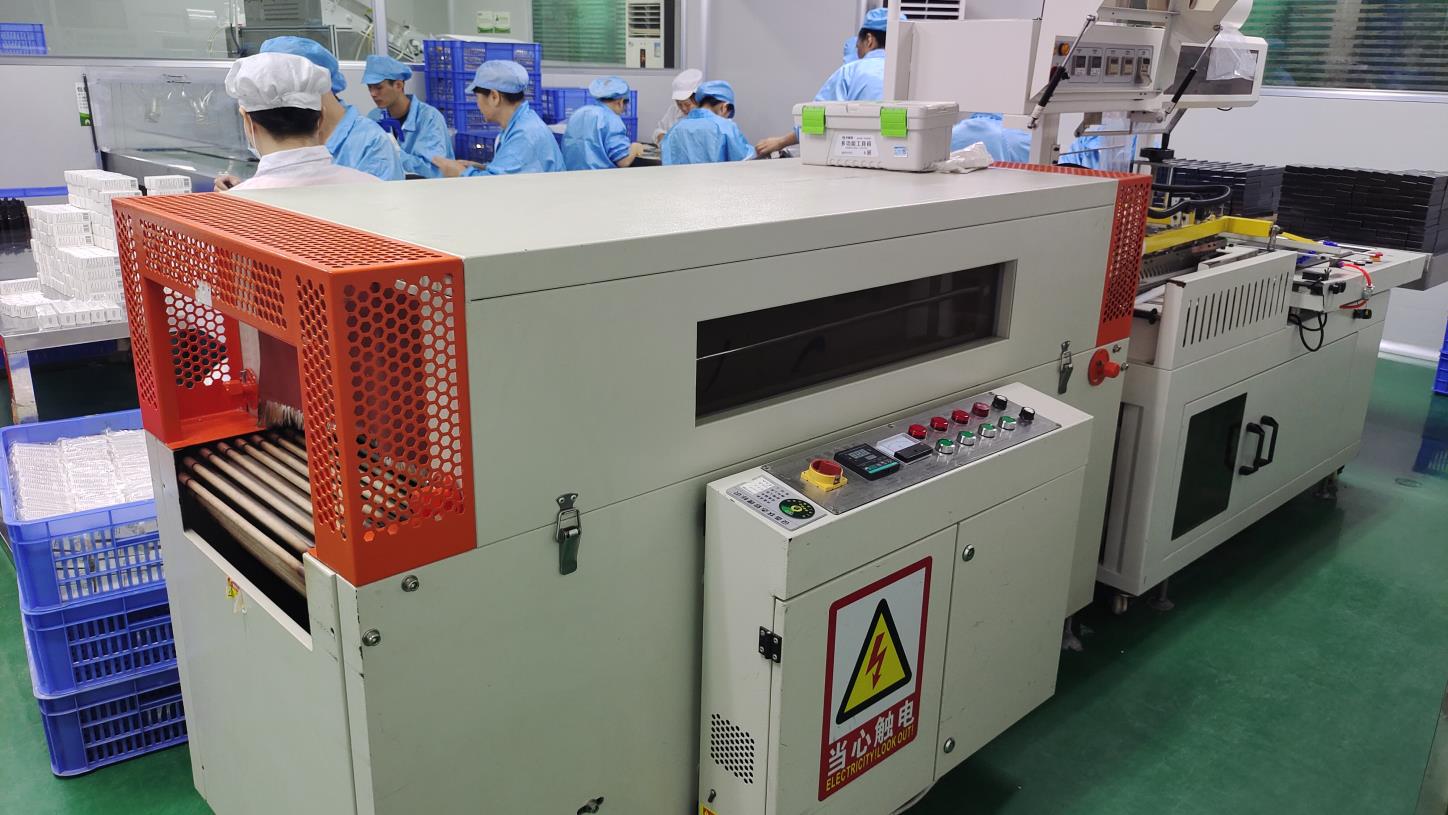 Heat shrink film packaging machine for final cosmetics product wrapping at Fmo Beauty