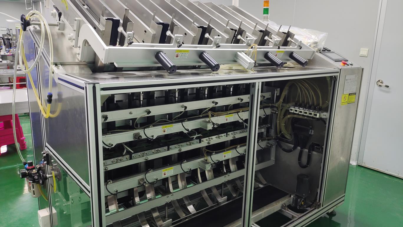 Facial mask filling machine at Fmo Beauty factory — automated sheet mask and cream mask production