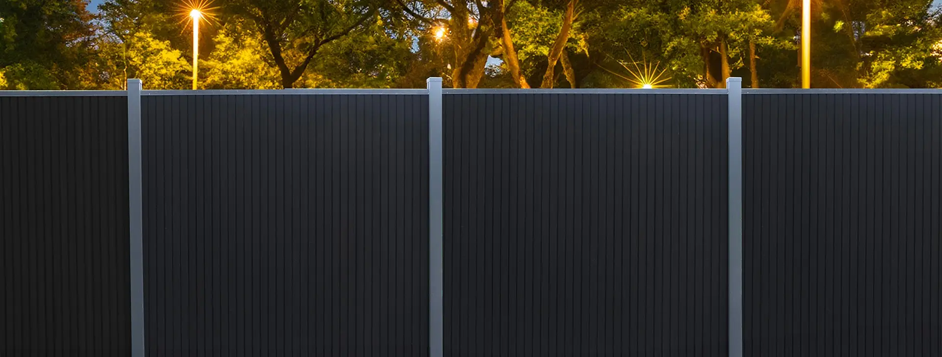 Forestar composite privacy fencing around a garden