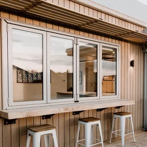 OUNA True Accordion Style Aluminum Folding Window Compacts Fully to One Side for Maximum Opening Clear Width Custom Finishes