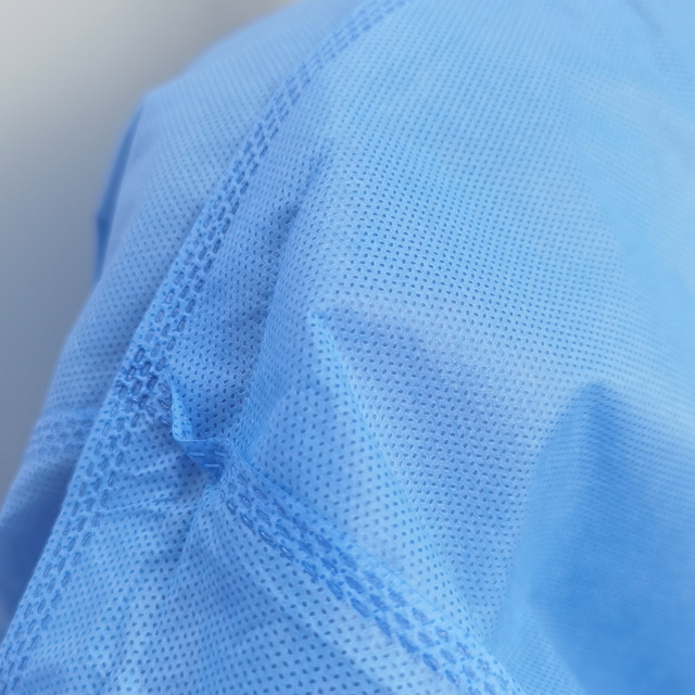 Bata de aislamiento protectora desechable no tejida azul para uso médico