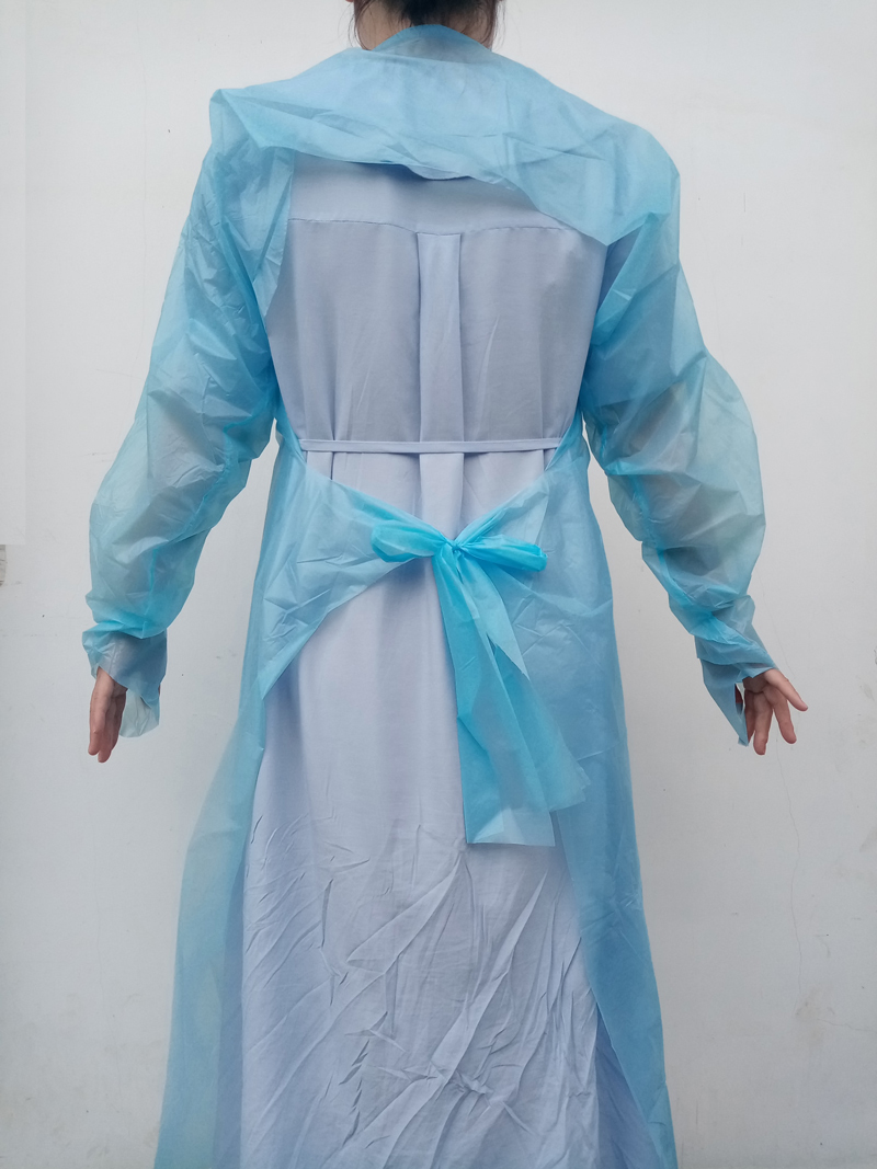 Ampliamente utilizado en medicina con bucle para el pulgar, bata de aislamiento desechable, bata de CPE, delantal
