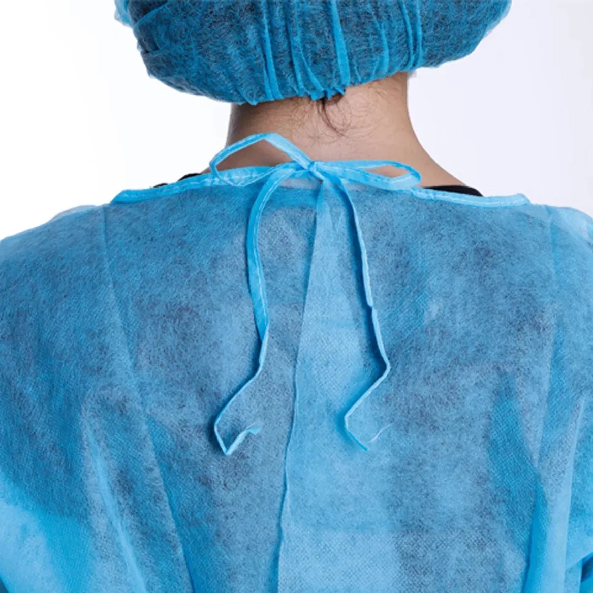Gala de aislamiento desechable impermeable con puños de punto no tejido personalizada para venta al por mayor