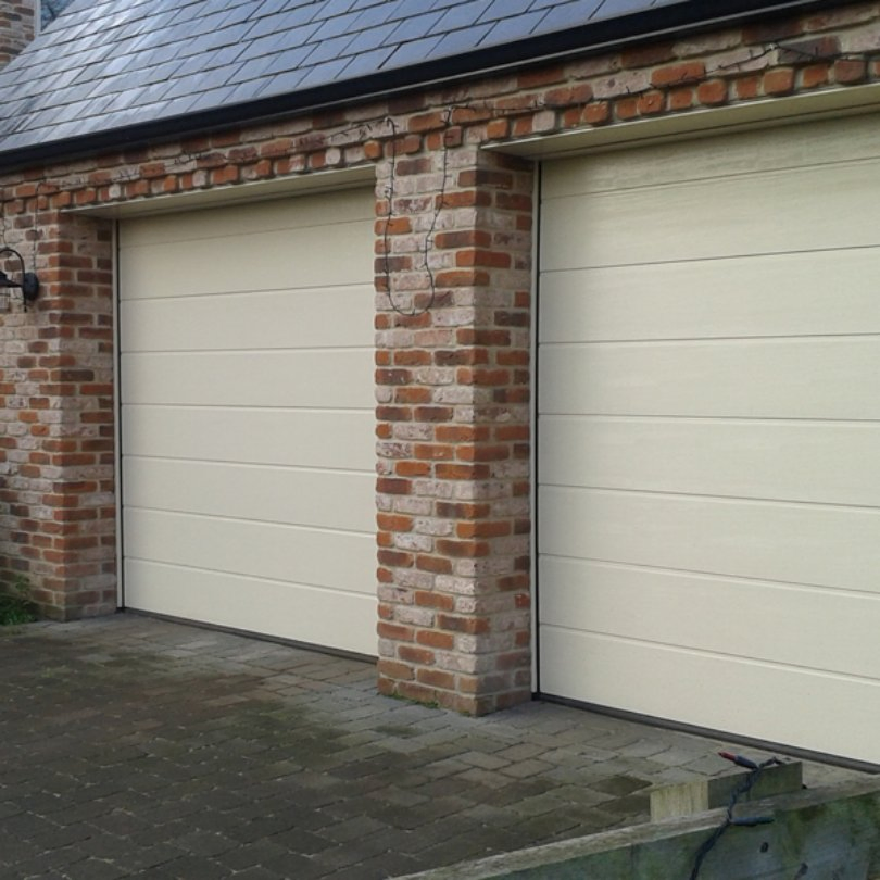 Pressure-Treated Sectional Garage Door for Resisting Rot in Humid Environments