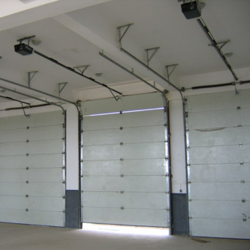 Pressure-Treated Sectional Garage Door for Resisting Rot in Humid Environments