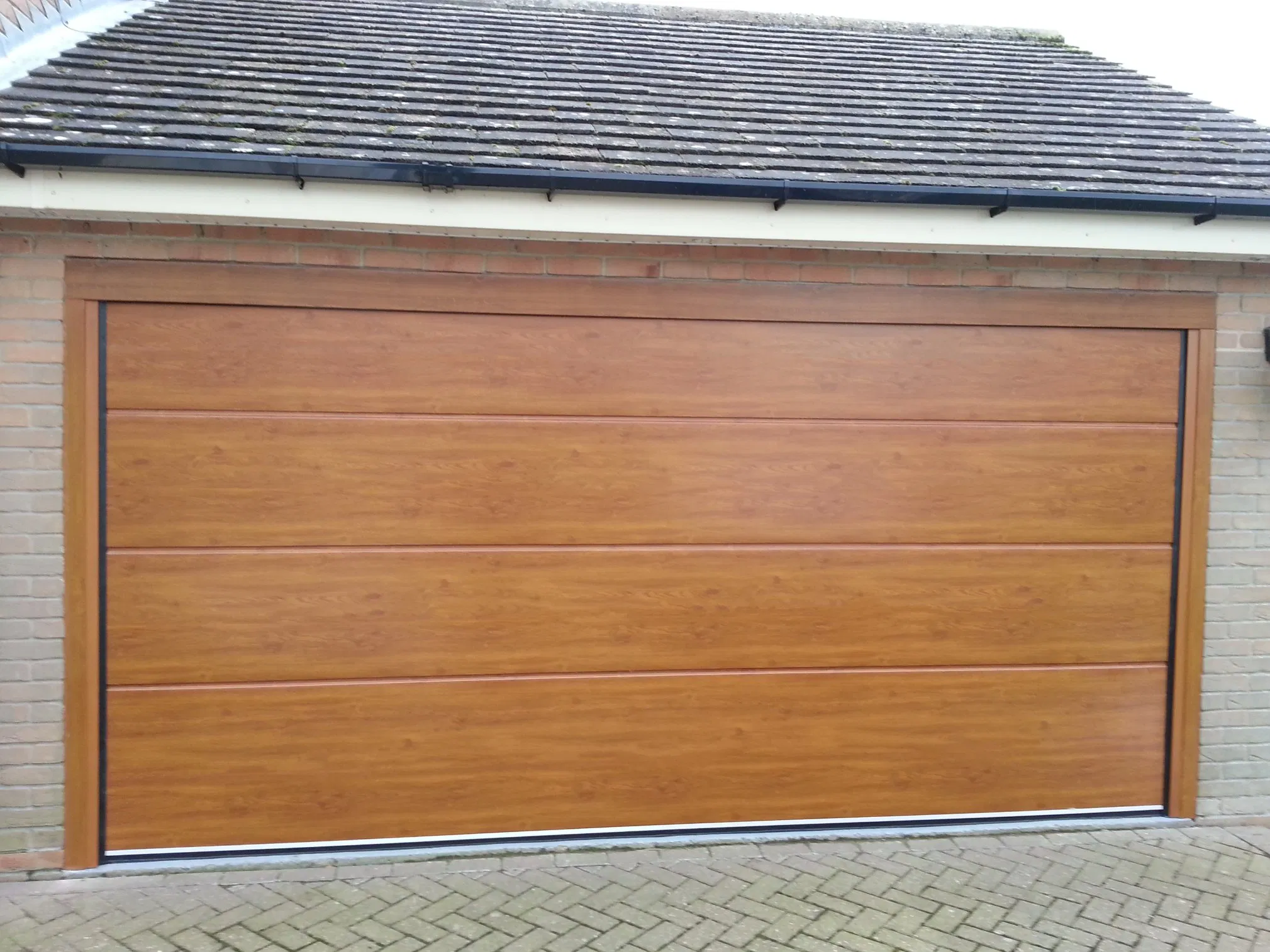 Modern Glass Garage Door with Smart Automation for Villas